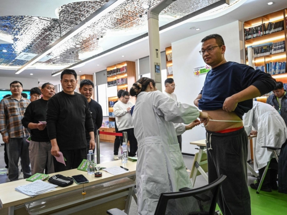 Kinijoje žmonės meta svorį mainais į jautieną